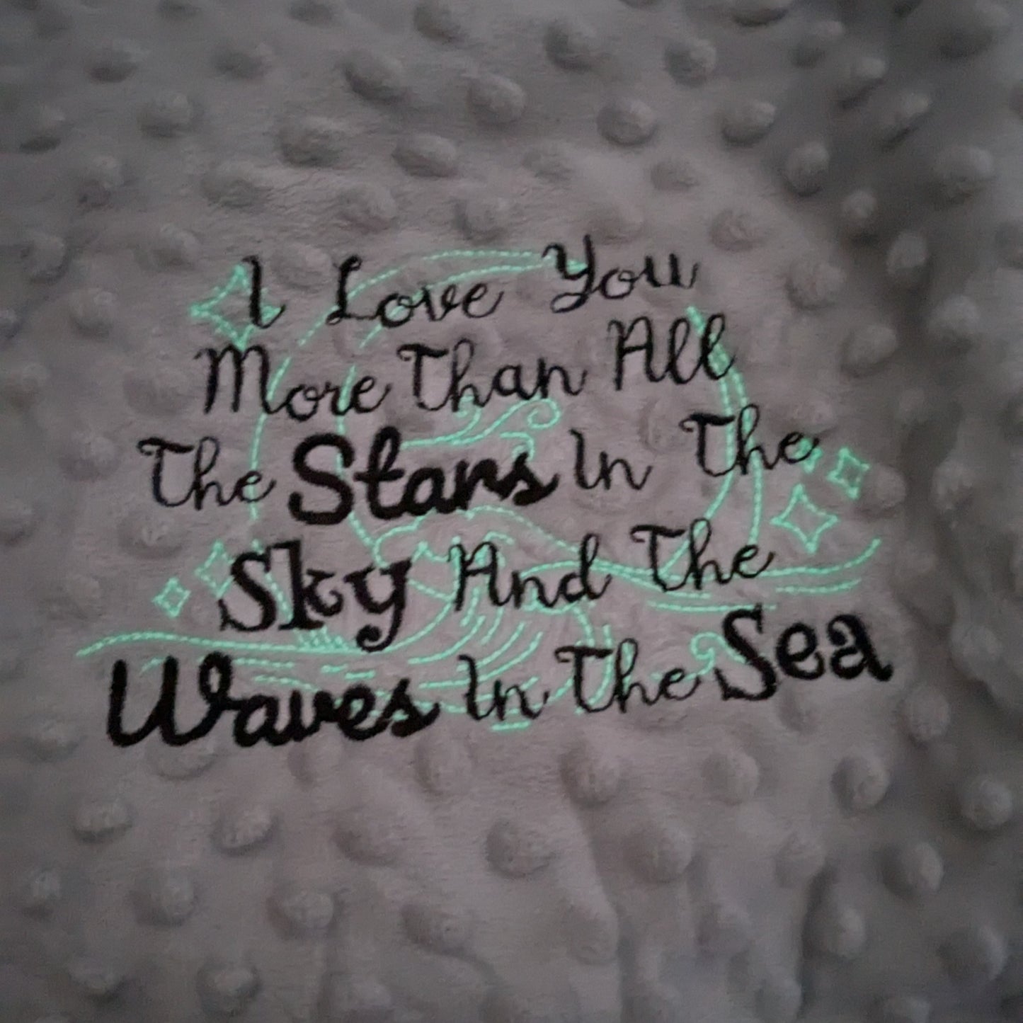 Beautiful embroidered baby blanket with glow in the dark stars.